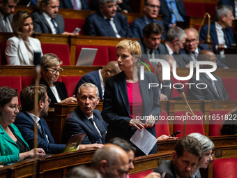 Clementine Autin, deputy of the Ecologists and Socialists group, sits among the benches of the General Assembly, the French Parliament, on t...