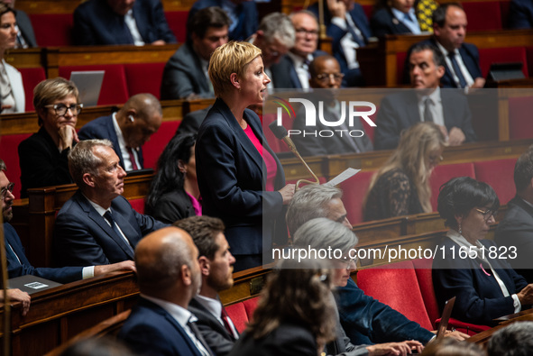 Clementine Autin, deputy of the Ecologists and Socialists group, sits among the benches of the General Assembly, the French Parliament, on t...