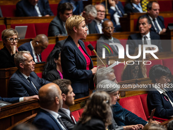 Clementine Autin, deputy of the Ecologists and Socialists group, sits among the benches of the General Assembly, the French Parliament, on t...