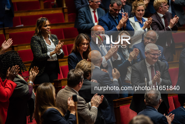 Sandrine Josso, MP from the Group of the Democrats, applauds after her speech in Parliament on the day of the no-confidence motion against P...