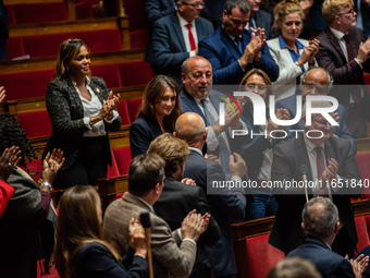 Sandrine Josso, MP from the Group of the Democrats, applauds after her speech in Parliament on the day of the no-confidence motion against P...