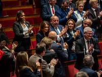 Sandrine Josso, MP from the Group of the Democrats, applauds after her speech in Parliament on the day of the no-confidence motion against P...