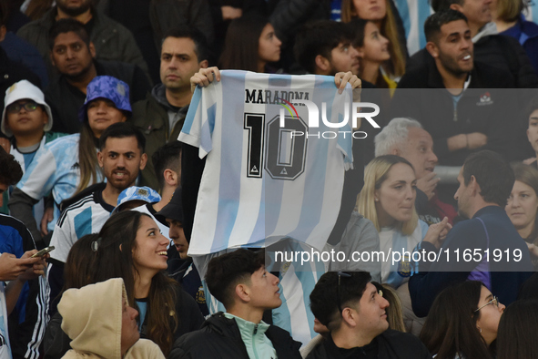 An Argentina fan wears a Diego Maradona t-shirt before a World Cup Qualifiers match between Argentina and Paraguay at Estadio Mas Monumental...