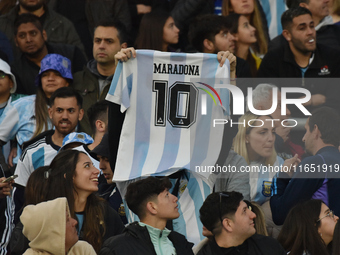 An Argentina fan wears a Diego Maradona t-shirt before a World Cup Qualifiers match between Argentina and Paraguay at Estadio Mas Monumental...