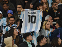 An Argentina fan wears a Diego Maradona t-shirt before a World Cup Qualifiers match between Argentina and Paraguay at Estadio Mas Monumental...