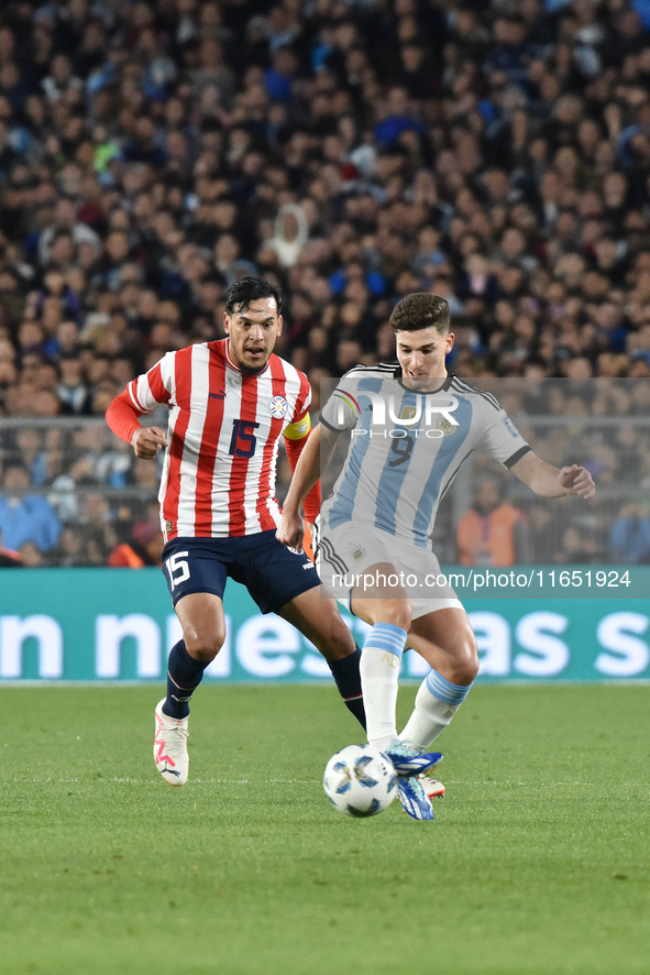 Gustavo Gomez of Paraguay and Julian Alvarez of Argentina participate in a World Cup Qualifiers match between Argentina and Paraguay at Esta...