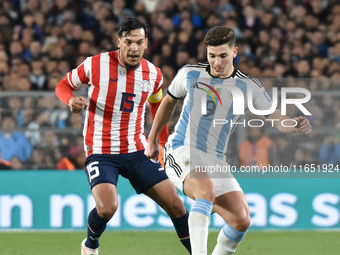 Gustavo Gomez of Paraguay and Julian Alvarez of Argentina participate in a World Cup Qualifiers match between Argentina and Paraguay at Esta...