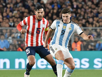 Gustavo Gomez of Paraguay and Julian Alvarez of Argentina participate in a World Cup Qualifiers match between Argentina and Paraguay at Esta...