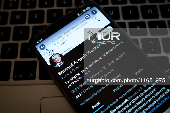 The Twitter (X) profile of Bernard Arnault Tracker displays on a smartphone screen in Athens, Greece, on October 9, 2024. (Photo Illustratio...