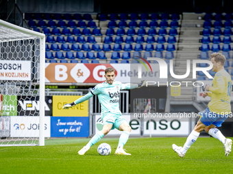 Go Ahead Eagles goalkeeper Jari de Busse and RKC player Reuven Niemeijer participate in the friendly match between RKC and Go Ahead Eagles a...