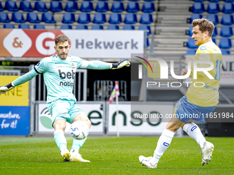 Go Ahead Eagles goalkeeper Jari de Busse and RKC player Reuven Niemeijer participate in the friendly match between RKC and Go Ahead Eagles a...