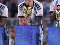 Angel Di Maria celebrates the World Champions title after an International Friendly match between Argentina and Panama at Estadio Mas Monume...