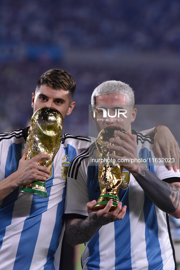 Exequiel Palacios and Enzo Fernandez of Argentina celebrate the World Champions title after an international friendly match between Argentin...