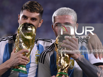 Exequiel Palacios and Enzo Fernandez of Argentina celebrate the World Champions title after an international friendly match between Argentin...