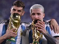 Exequiel Palacios and Enzo Fernandez of Argentina celebrate the World Champions title after an international friendly match between Argentin...