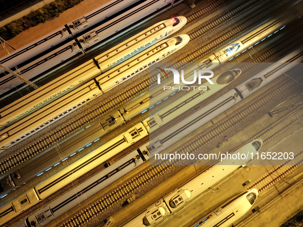 Bullet trains wait for departure at a domestic depot in Lianyungang, China, on October 9, 2024. 