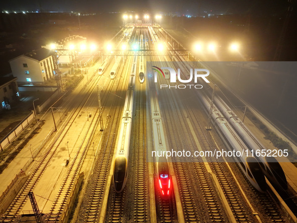 Bullet trains wait for departure at a domestic depot in Lianyungang, China, on October 9, 2024. 