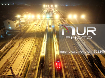 Bullet trains wait for departure at a domestic depot in Lianyungang, China, on October 9, 2024. (