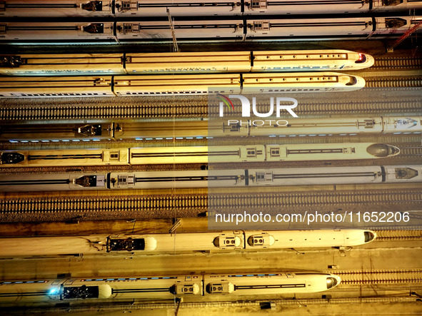 Bullet trains wait for departure at a domestic depot in Lianyungang, China, on October 9, 2024. 