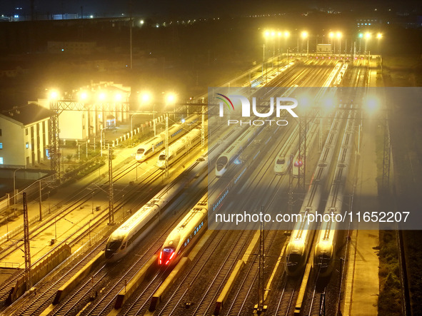 Bullet trains wait for departure at a domestic depot in Lianyungang, China, on October 9, 2024. 