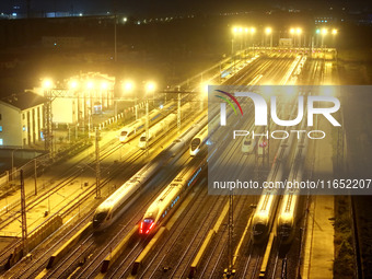 Bullet trains wait for departure at a domestic depot in Lianyungang, China, on October 9, 2024. (