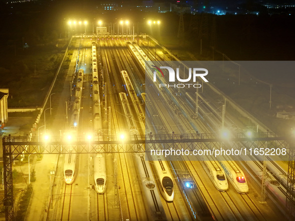 Bullet trains wait for departure at a domestic depot in Lianyungang, China, on October 9, 2024. 