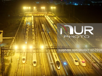 Bullet trains wait for departure at a domestic depot in Lianyungang, China, on October 9, 2024. (