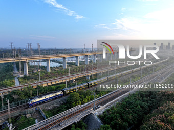 A bullet train runs in Lianyungang, China, on October 9, 2024. (