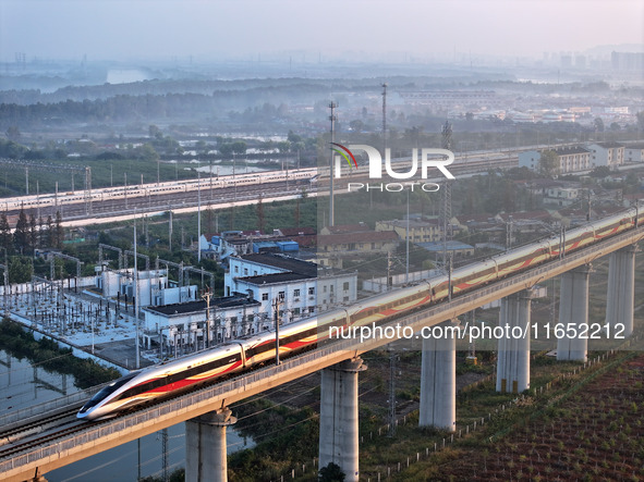 A bullet train runs in Lianyungang, China, on October 9, 2024. 