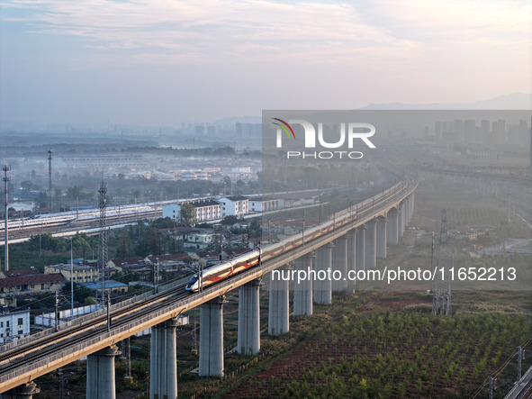 A bullet train runs in Lianyungang, China, on October 9, 2024. 