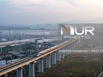 A bullet train runs in Lianyungang, China, on October 9, 2024. (