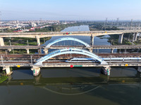 A bullet train runs on a railway bridge in Lianyungang, China, on October 9, 2024. (