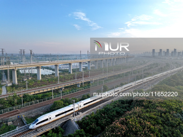 A bullet train runs in Lianyungang, China, on October 9, 2024. 