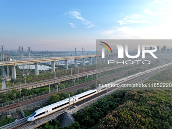 A bullet train runs in Lianyungang, China, on October 9, 2024. (