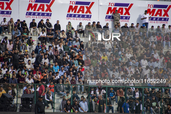 Spectators watch a cricket match during the Legends League Cricket match between Toyam Hyderabad and Southern Super Stars in Srinagar, Jammu...