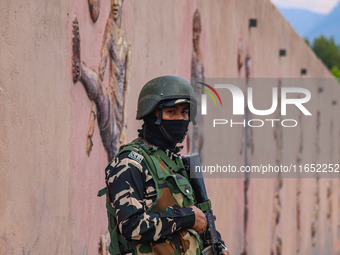 An Indian Paramilitary soldier stands guard during the Legends League Cricket match between Toyam Hyderabad and Southern Super Stars in Srin...