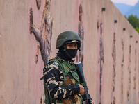 An Indian Paramilitary soldier stands guard during the Legends League Cricket match between Toyam Hyderabad and Southern Super Stars in Srin...