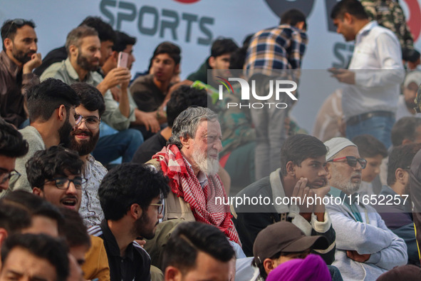 Spectators watch a cricket match during the Legends League Cricket match between Toyam Hyderabad and Southern Super Stars in Srinagar, Jammu...