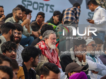 Spectators watch a cricket match during the Legends League Cricket match between Toyam Hyderabad and Southern Super Stars in Srinagar, Jammu...