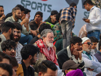 Spectators watch a cricket match during the Legends League Cricket match between Toyam Hyderabad and Southern Super Stars in Srinagar, Jammu...