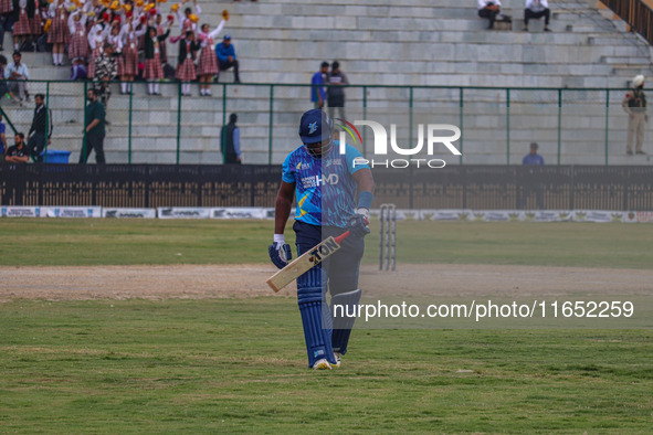 Zimbabwe's Hamilton Masakadza walks off after being dismissed by Ravi Jangid of India during the Legends League Cricket match between Toyam...