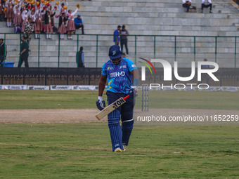 Zimbabwe's Hamilton Masakadza walks off after being dismissed by Ravi Jangid of India during the Legends League Cricket match between Toyam...