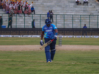 Zimbabwe's Hamilton Masakadza walks off after being dismissed by Ravi Jangid of India during the Legends League Cricket match between Toyam...