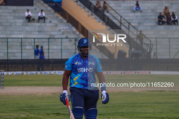 Zimbabwe's Hamilton Masakadza walks off after being dismissed by Ravi Jangid of India during the Legends League Cricket match between Toyam...