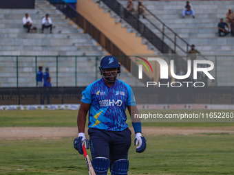 Zimbabwe's Hamilton Masakadza walks off after being dismissed by Ravi Jangid of India during the Legends League Cricket match between Toyam...