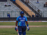 Zimbabwe's Hamilton Masakadza walks off after being dismissed by Ravi Jangid of India during the Legends League Cricket match between Toyam...