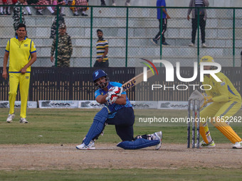 India's Kedar Jadhav plays a shot during the Legends League Cricket match between Toyam Hyderabad and Southern Super Stars in Srinagar, Jamm...