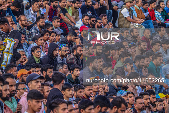 Spectators watch a cricket match during the Legends League Cricket match between Toyam Hyderabad and Southern Super Stars in Srinagar, Jammu...