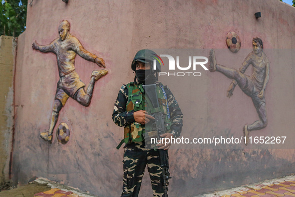 An Indian Paramilitary soldier stands guard during the Legends League Cricket match between Toyam Hyderabad and Southern Super Stars in Srin...