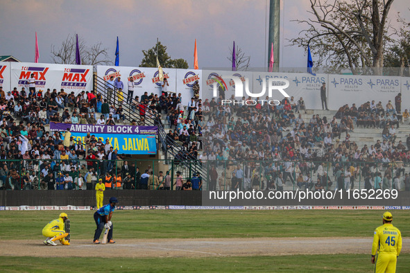 Spectators watch a cricket match during the Legends League Cricket match between Toyam Hyderabad and Southern Super Stars in Srinagar, Jammu...